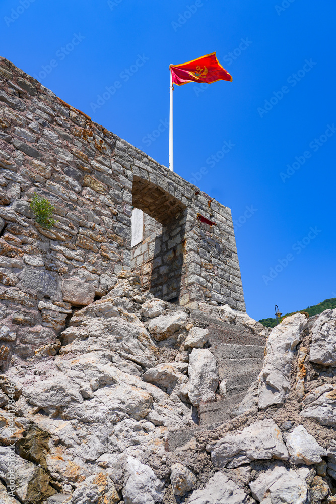 Kastio Castle built on a peninsula in Petrovac na Moru, a resort town located on the coast of the Adriatic Sea in Montenegro
