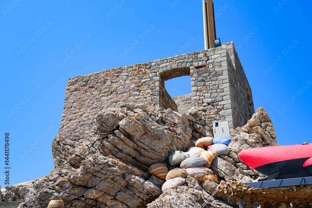 Kastio Castle built on a peninsula in Petrovac na Moru, a resort town located on the coast of the Adriatic Sea in Montenegro