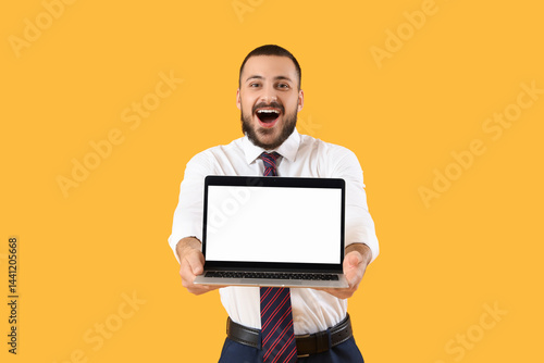 Happy young businessman wit...