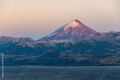 sunrise at lago huechulafquen and peak of lanin volcano at lanin national park, patagonia, argentina