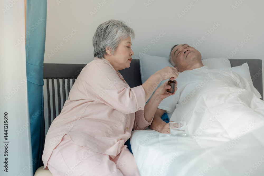 Obraz premium An elderly woman tends to her husband by administering medication while he rests in bed. The image emphasizes caregiving, compassion, and elderly support in a peaceful home setting.