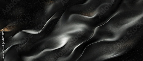 Abstract flowing black and silver metallic waves with subtle glowing gold particles creating a smooth and dynamic textured surface