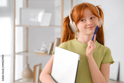 Little redhead student with...