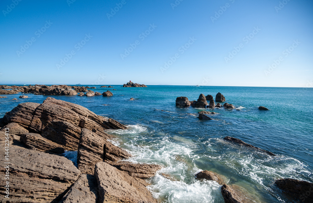 View to horizon over Rocky base on Mount Maunganui