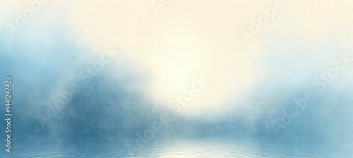 Calm and foggy early morning scene over still water with soft light and gentle ripples creating a peaceful and serene atmosphere