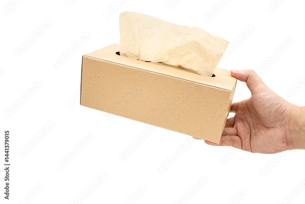 Hand taking Brown tissue paper box isolated on white background. Copy space for text. Nice natural cardboard box of paper tissue.