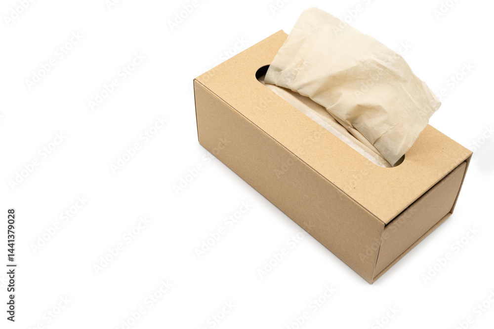 Brown tissue paper box isolated on white background with Clipping path. Copy space for text. Nice natural cardboard box of paper tissue.