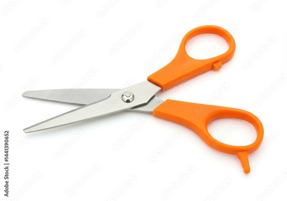 A pair of open scissors with orange handles lying on a white surface in a studio setting view from above A pair of open scissors with orange handles lying on a white surface in a studio setting view from above
