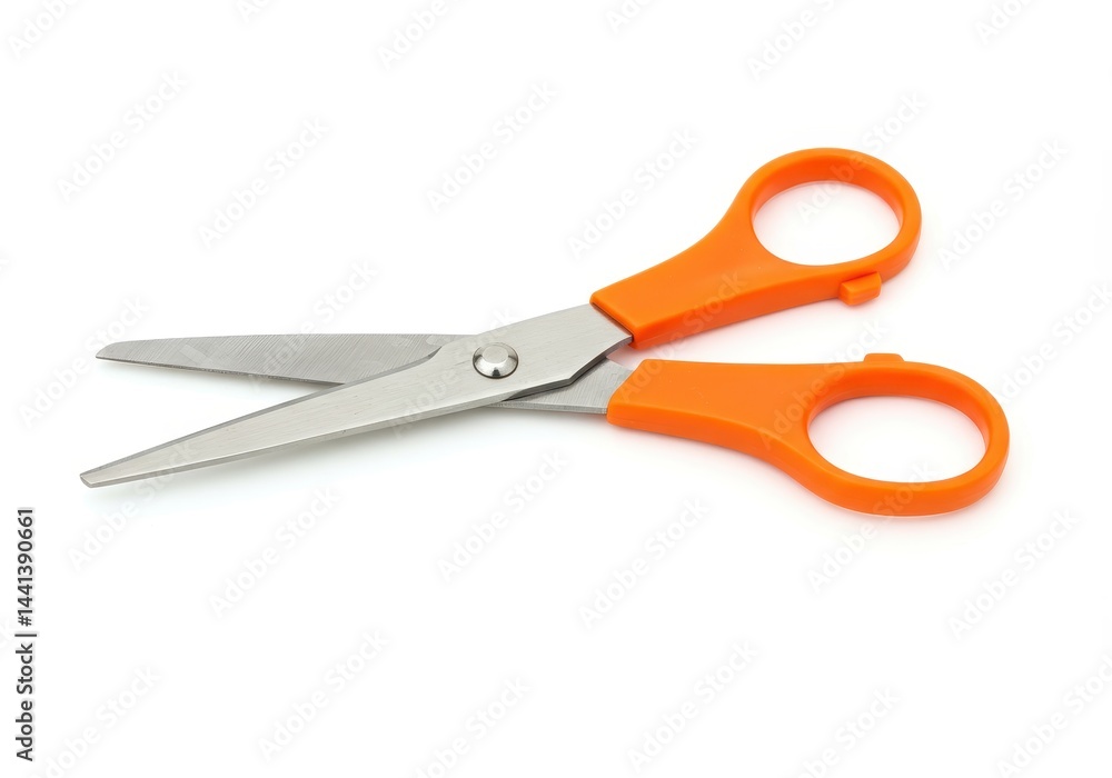 A pair of scissors with orange handles and silver blades on a plain white background in a studio shot A pair of scissors with orange handles and silver blades on a plain white background in a studio shot