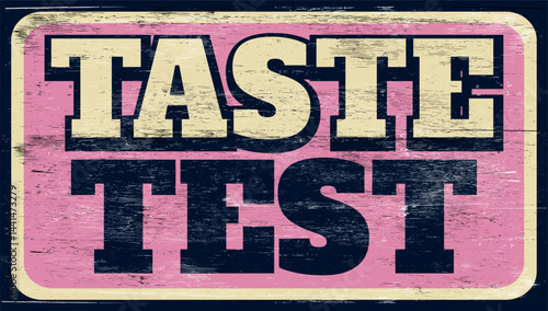 Aged vintage taste test sign on wood