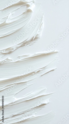 Obraz na płótnie Creamy white texture background showcasing smooth strokes and light shadows for cosmetic or skincare product presentation with a minimalist aesthetic and clean design w salonie