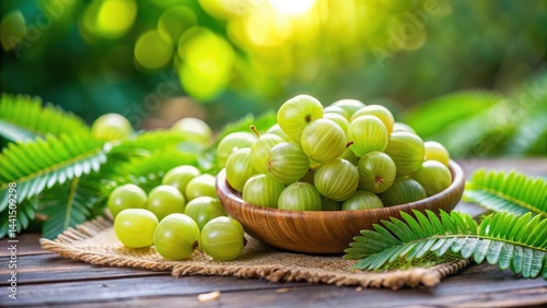 Fresh Amla Emblica Indian Gooseberry Fruits on Green Vegetable Background , fruit salad