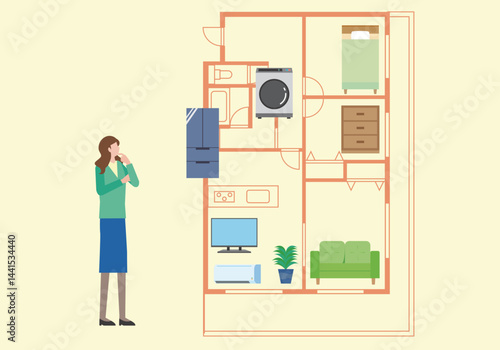 間取りと家具の配置を考える女性