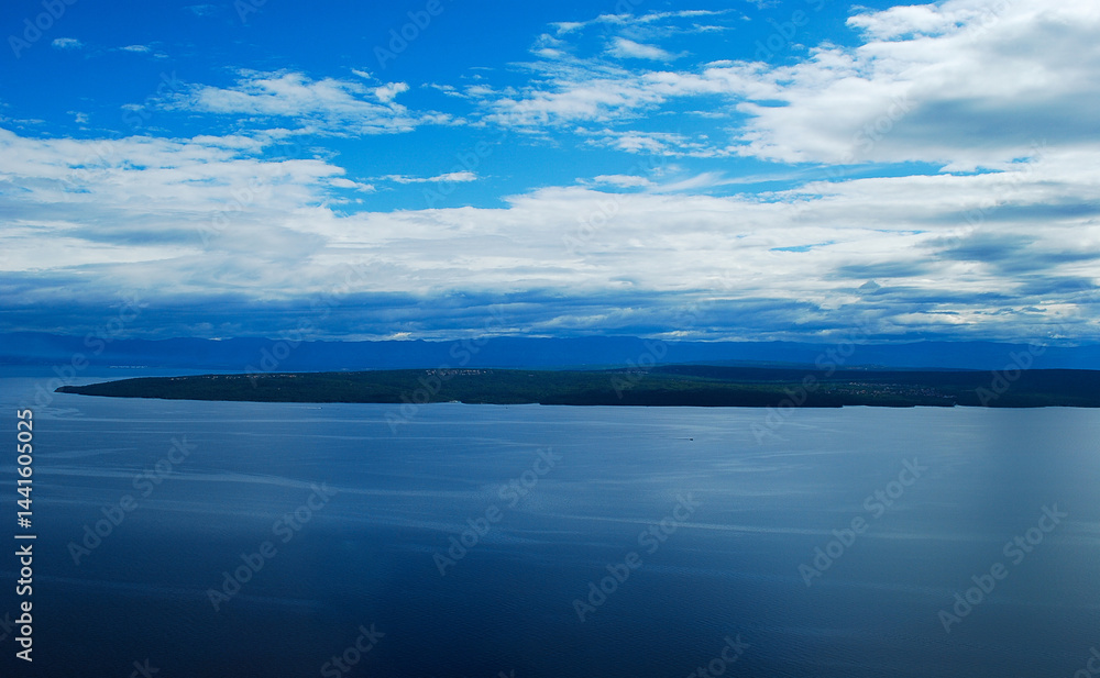 Fototapeta premium the calm splendid sea merges with the islands and the sky