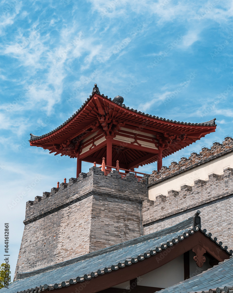 Historic architecture showcases traditional Chinese design against a vibrant blue sky in a scenic location Historic architecture showcases traditional Chinese design against a vibrant blue sky in a scenic location