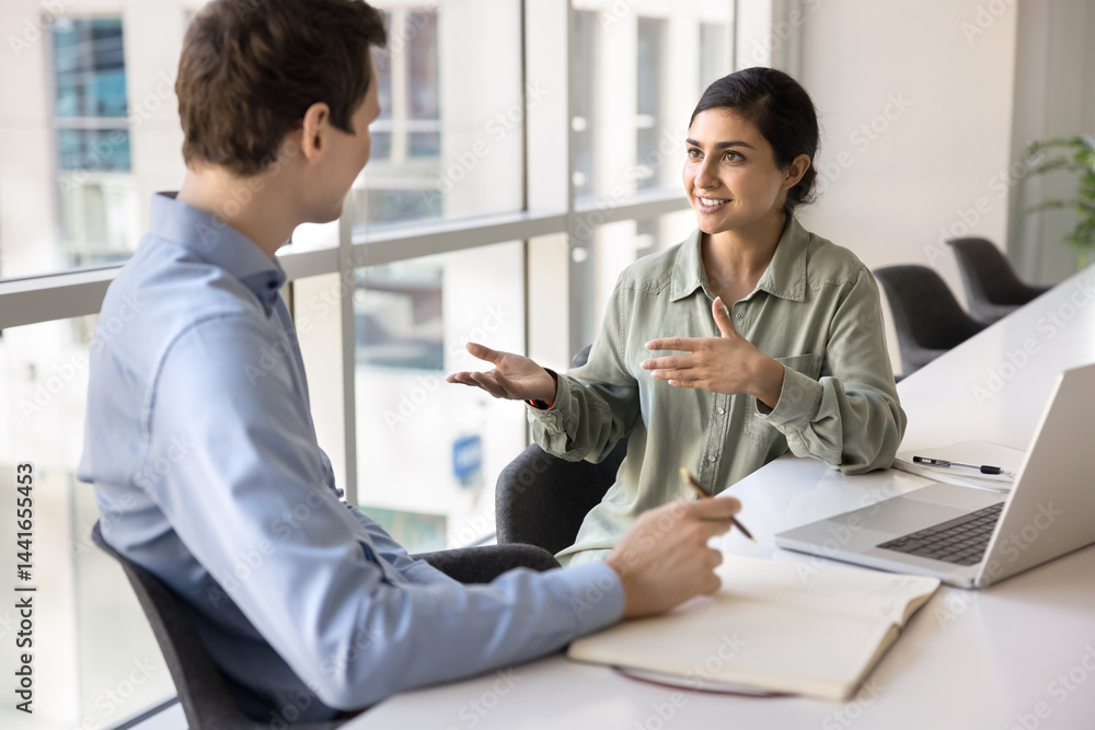 Ταπετσαρία Indian female manager leads formal conversation with company client, sell services, making profitable commercial proposal, sit at desk with laptop in modern meeting room