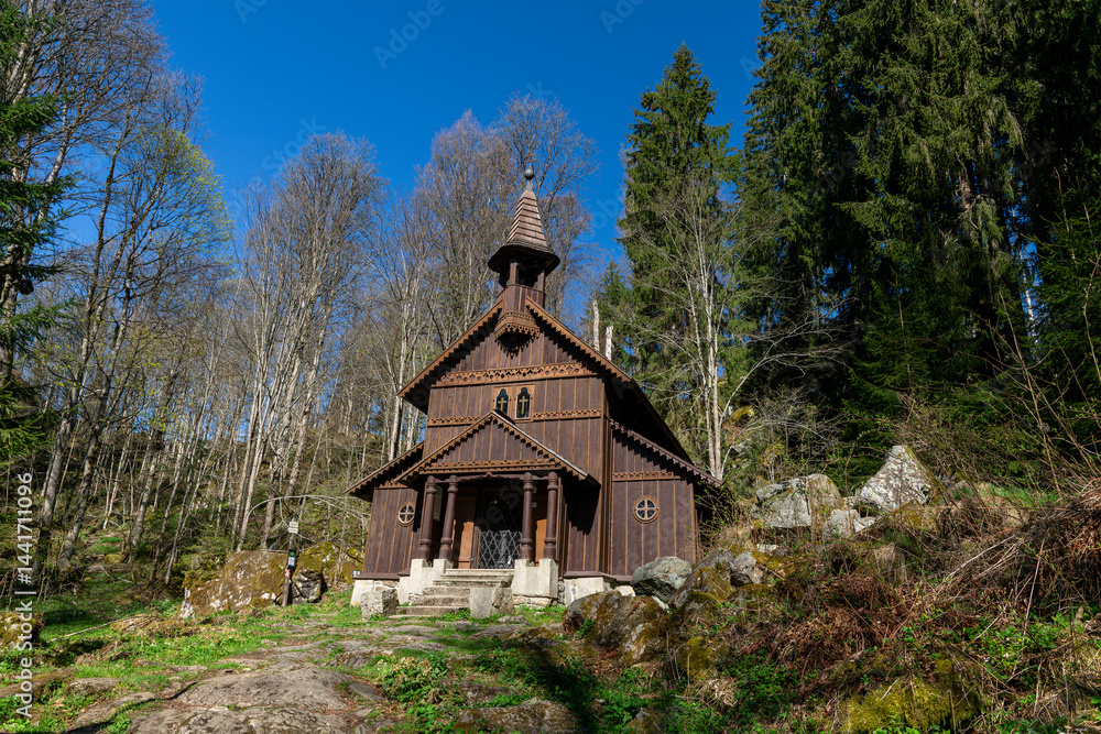 Old wooden pilgrimage rural Chapel of Virgin Mary (Stožecká kaple in Czech) standing in a forest of Šumava National Park - Stožec, Czech Republic, Europe