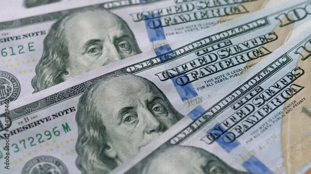 A closeup image depicting U.S. Hundred Dollar Bills showcasing their intricate design and details A closeup image depicting U.S. Hundred Dollar Bills showcasing their intricate design and details