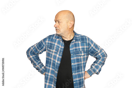 a man with his arms on his hips looking to the left