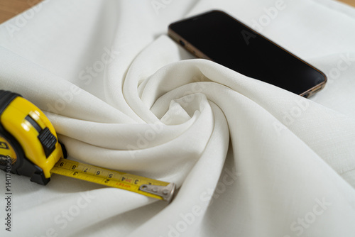 Swirled Twisted Fabric with measuring tape and phone