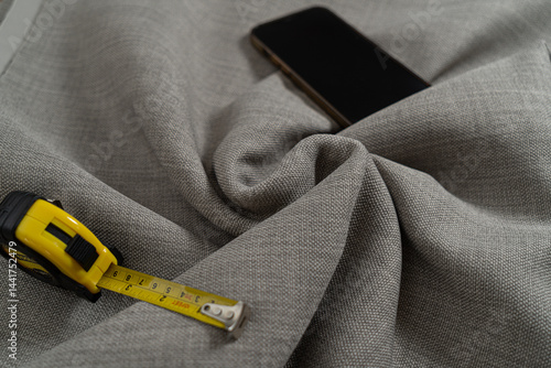 Swirled Twisted Fabric with measuring tape and phone