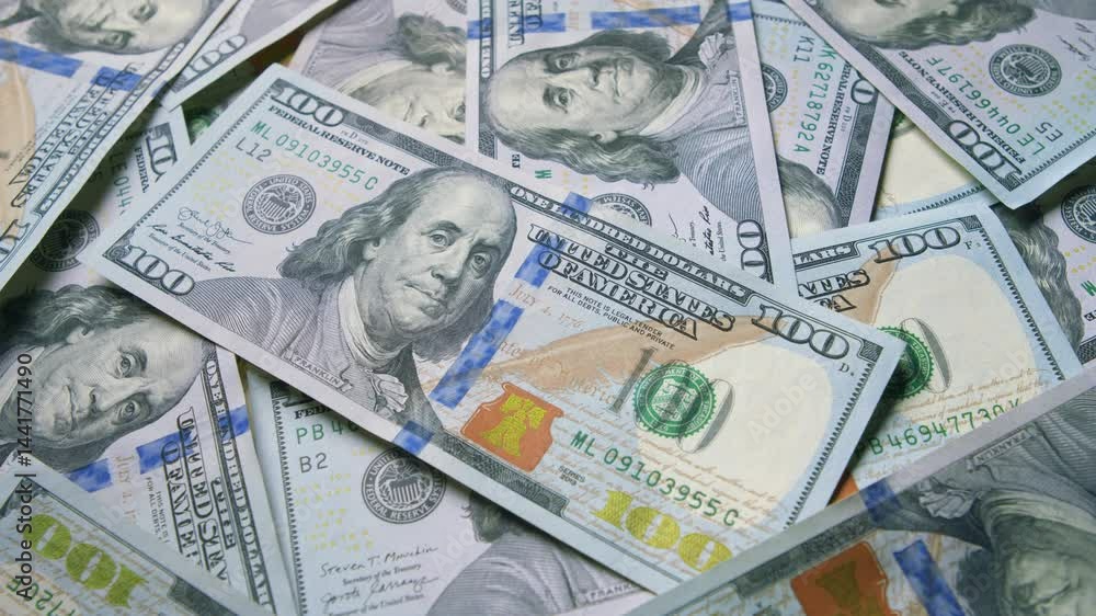 A Stack of U.S. Dollar Bills That Are Neatly Piled Together in an Organized Manner A Stack of U.S. Dollar Bills That Are Neatly Piled Together in an Organized Manner
