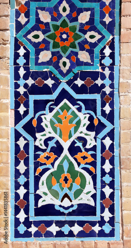 Vertical background with detail of ancient mosaic walls with floral ornament. Traditional tile decoration on wall, Samarkand, Uzbekistan