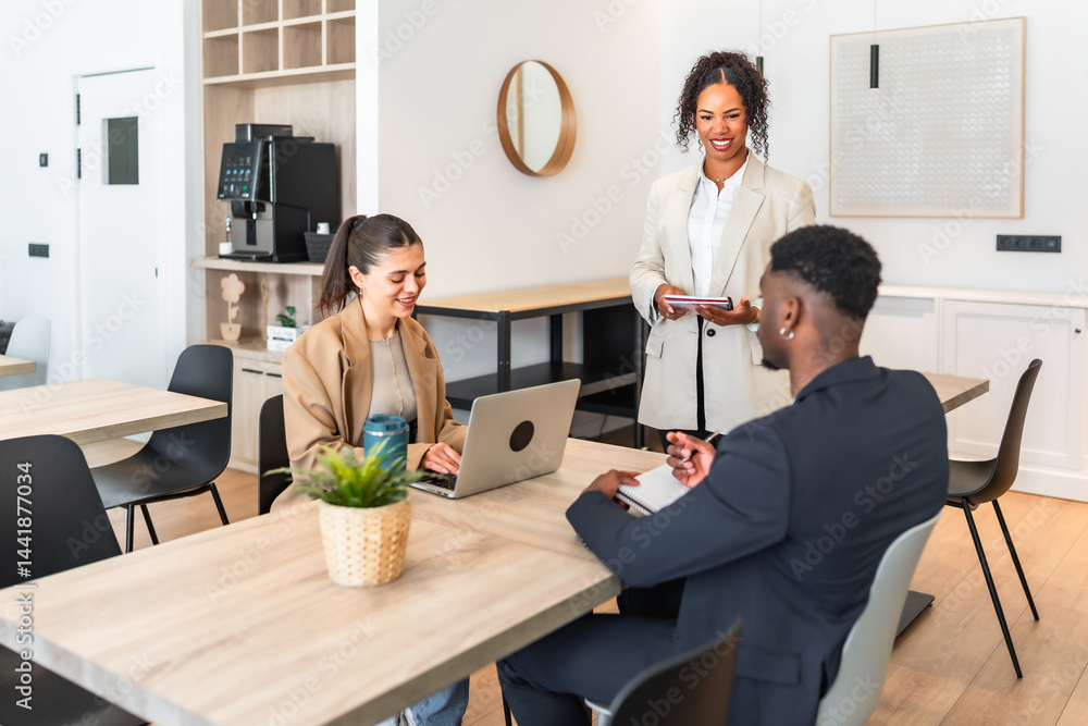 Business team collaborating on project in modern office space
