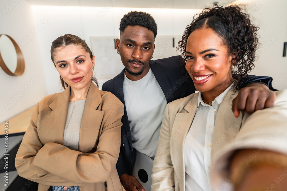Business team taking selfie in modern office
