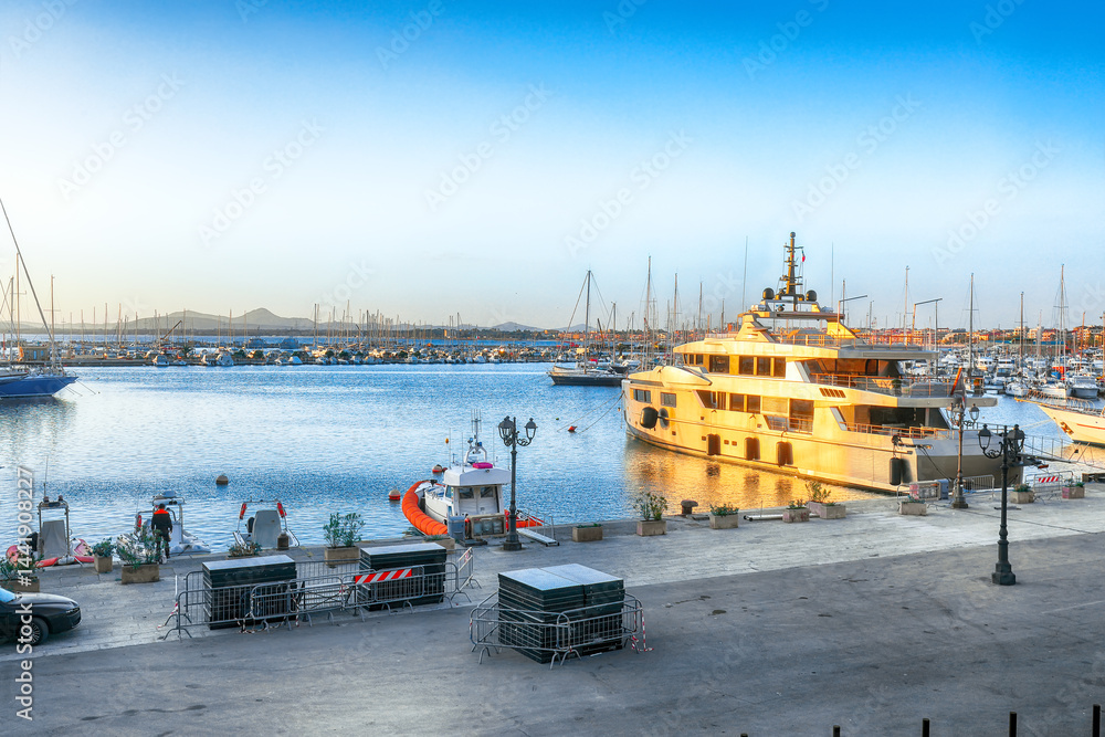 Unbelivable evening view of Alghero port . Mediterranean seascape.