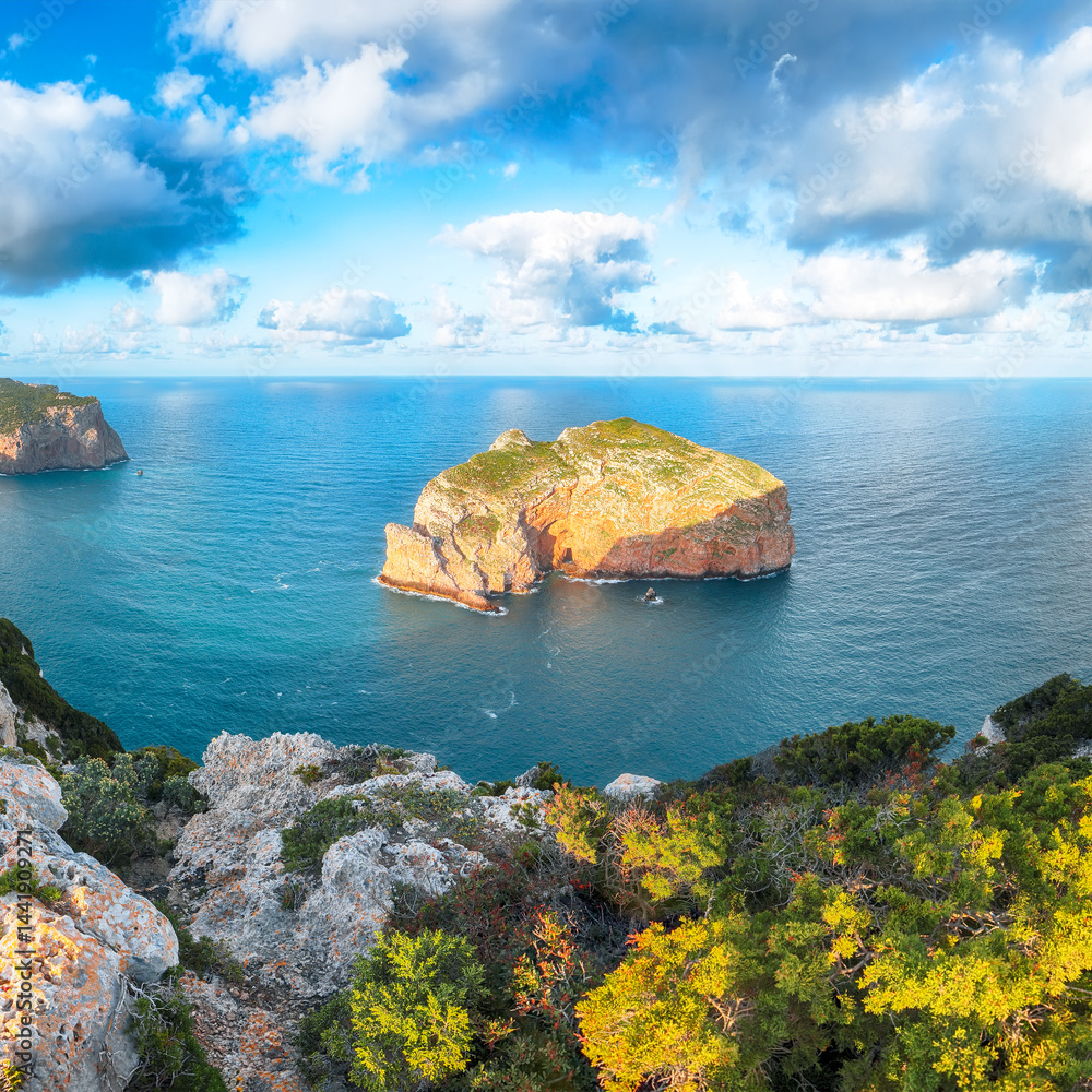 Unbelivable morning view on Foradada islet and Palombi cave from Cacccia cape.