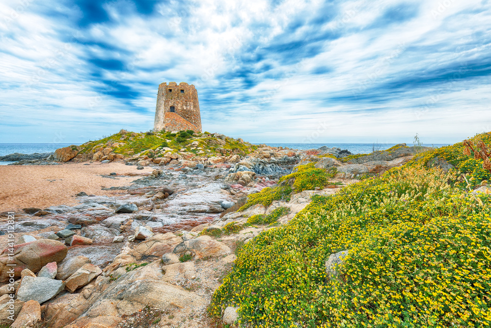 Exciting sunset view of Bari Sardo tower in the Gulf of Orosei.