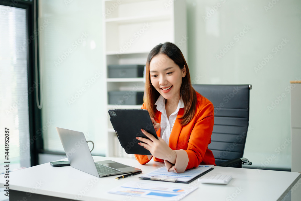 businesswoman checking time feeling motivated waiting for leaving office do on their tablet, laptop and taking notes businesswoman checking time feeling motivated waiting for leaving office do on their tablet, laptop and taking notes