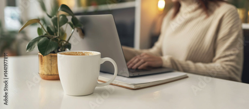 Obraz na płótnie Minimalist and stylish, this scene features a hijabi woman working or studying on her laptop in a cozy Scandinavian room, great for productivity and interior design visuals w salonie