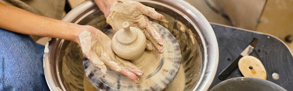 Creating unique pottery pieces in a vibrant and lively artisanal studio environment