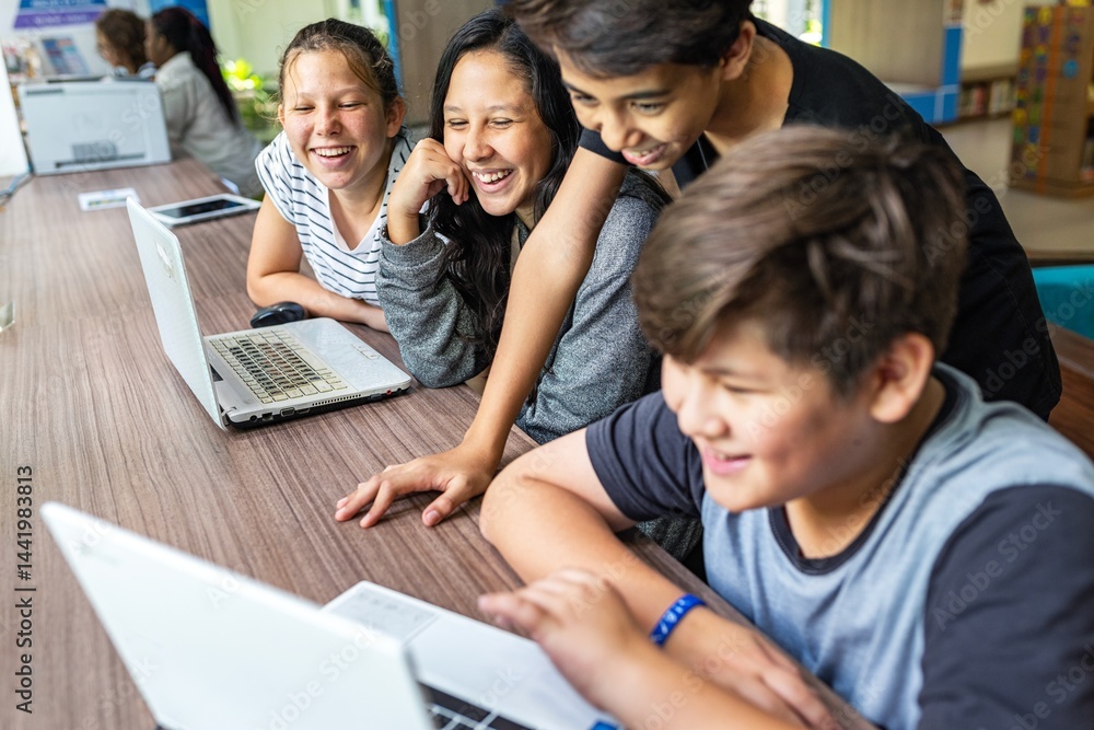 Group of kids using laptops, smiling and learning together. Diverse children engaged with technology, enjoying teamwork and education. Happy kids learning with a laptop, online education for students. Group of kids using laptops, smiling and learning together. Diverse children engaged with technology, enjoying teamwork and education. Happy kids learning with a laptop, online education for students.