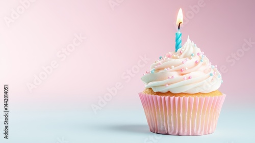 Obraz na płótnie Birthday cupcake with candle: A single, delicious cupcake adorned with creamy frosting, colorful sprinkles, and a lit candle. Perfect for celebrating a birthday or special occasion. w salonie