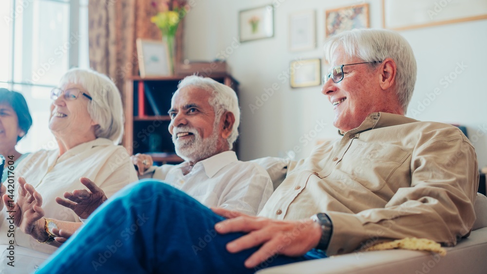 Group of diverse elderly friends sitting on a couch, laughing and enjoying each other's company in a cozy living room setting. Diverse old people talking and sitting on a sofa. Group of diverse elderly friends sitting on a couch, laughing and enjoying each other's company in a cozy living room setting. Diverse old people talking and sitting on a sofa.