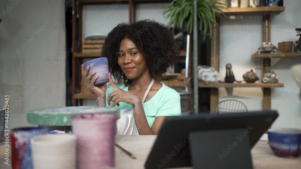 African woman make earth ware at workshop. Small business, hobbies. African woman make earth ware at workshop. Small business, hobbies.
