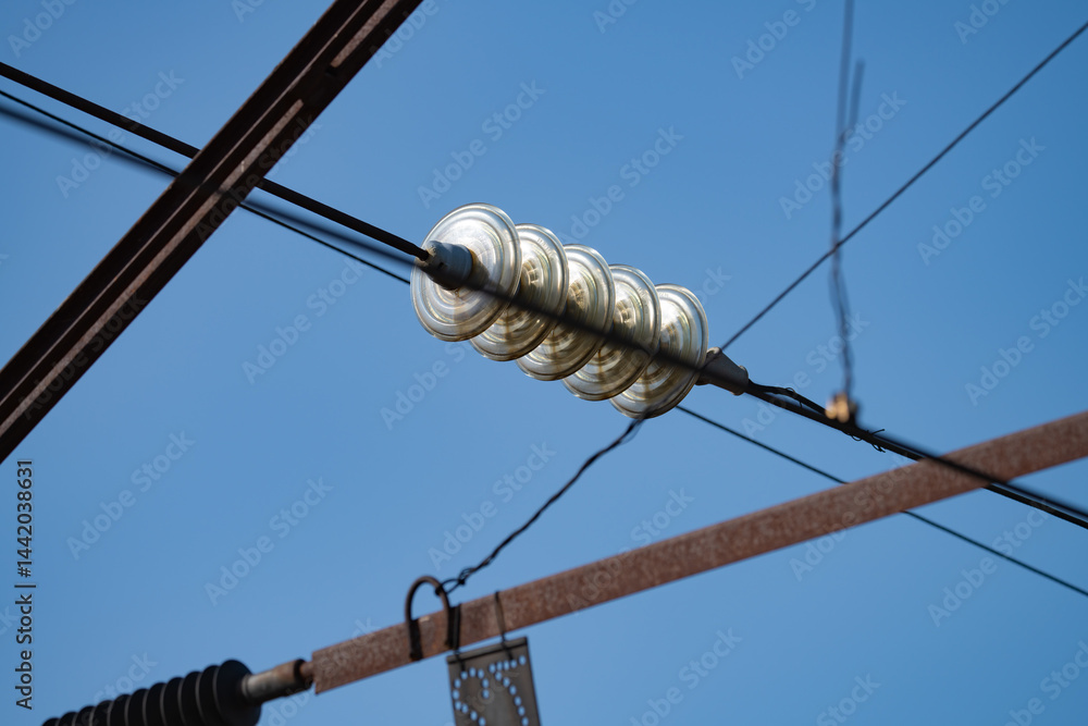 wires on a high-voltage power line next to the railway, spring day