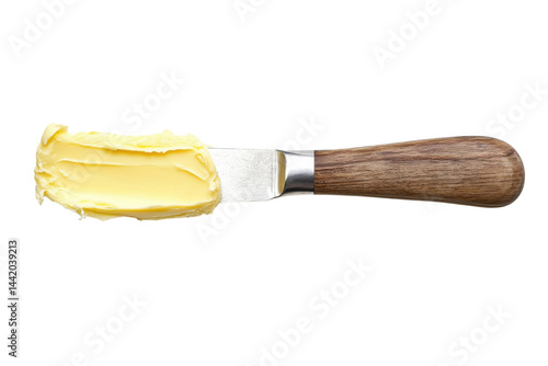 Creamy butter spread on a wooden handled knife perfect for baking or bread white background