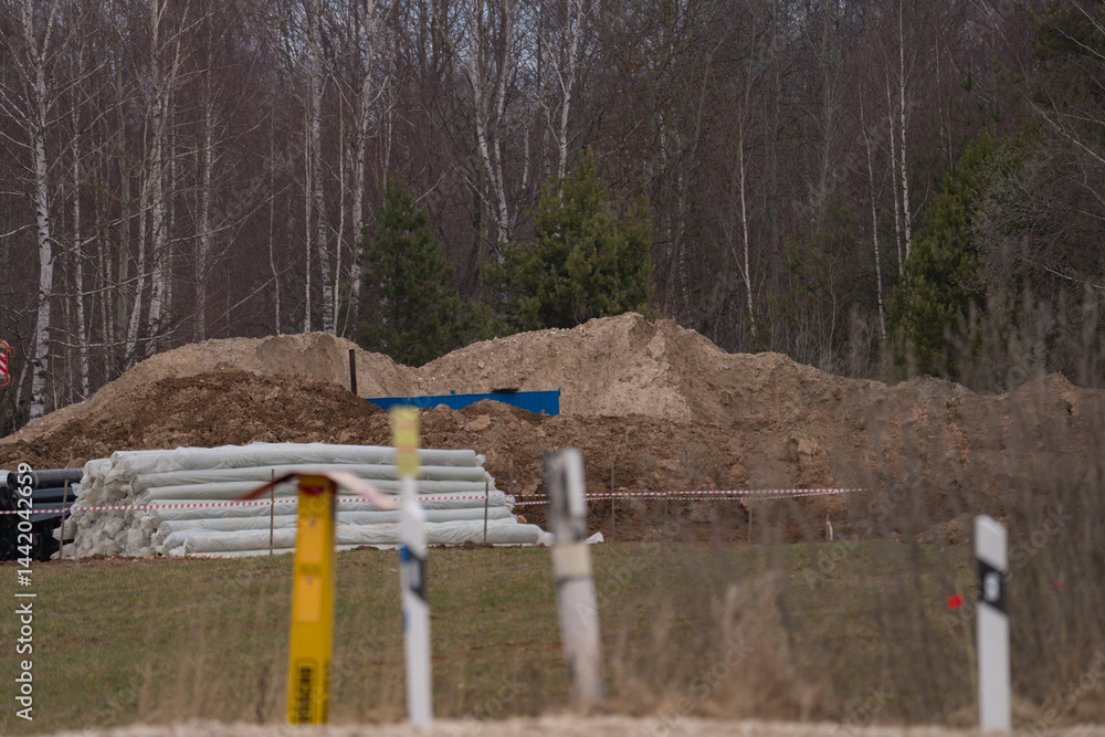 construction equipment on the section of the highway, laying of an underground gas pipeline
