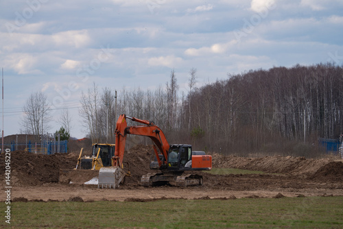 Obraz na płótnie construction equipment on the section of the highway, laying of an underground gas pipeline w salonie