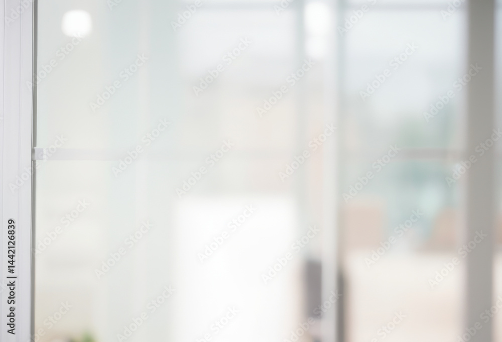 Blurred background of a bright indoor space with a glass door or window. Blurred background of a bright indoor space with a glass door or window.
