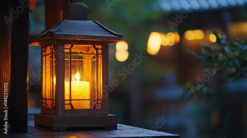 Obraz na płótnie Elegant Lantern with Candle Glowing in Serene Evening Atmosphere w salonie