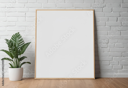 Modern Plant Poster Mockup: White Vertical Print in Thin Wooden Frame on Brick Wall with Greenery