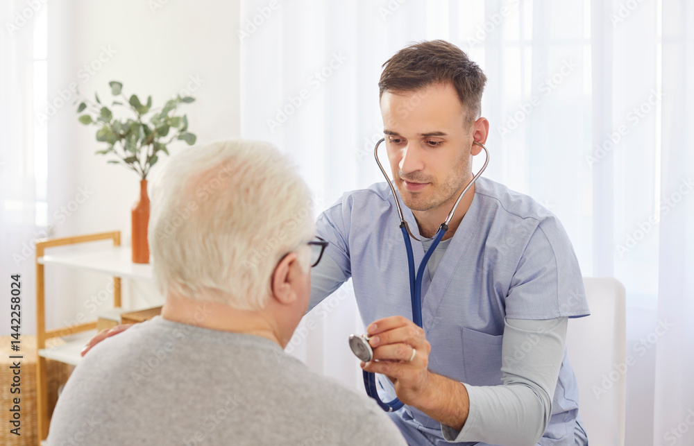 Confident doctor or caregiver uses a stethoscope to listen to the lungs and breathing of a senior man, a patient in a hospital. Healthcare, patient care, and respiratory examination.