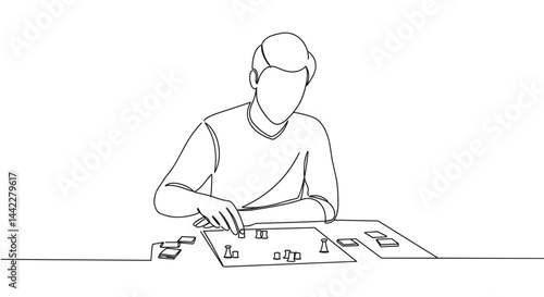 Man enjoying a board game while focusing on strategy  