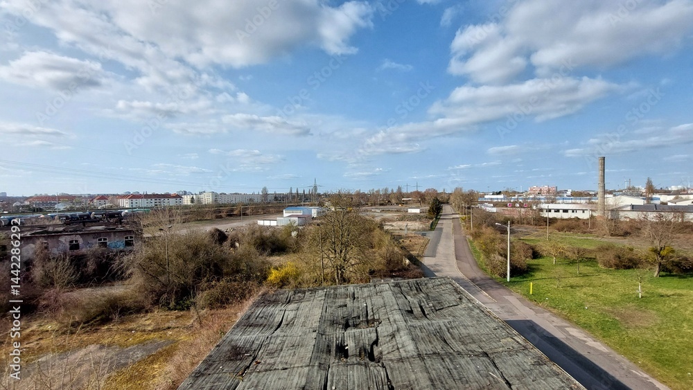 Industrial district overview in Germany with mix of urban housing, roads, and warehouse structures below