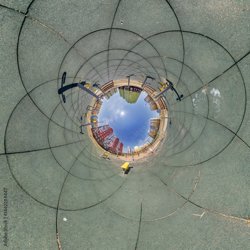blue hole sphere or globe little planet inside grass or sand or dry ground frame background with tractor tracks